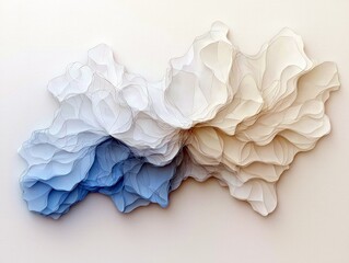 A delicate, layered paper sculpture with a gradient of blue to beige, creating a sense of organic flow and depth.