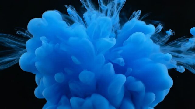 A luminous blue medusa jellyfish swims gracefully through deep black water in an abstract aquarium, creating a smoke-like pattern of marine nature