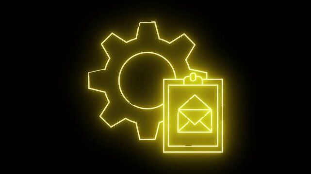 Yellow neon art gear beside an email envelope on clipboard isolated on a black backdrop