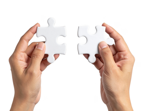 Hands connecting two white jigsaw puzzle pieces for a teamwork solution isolated on white and transparent background