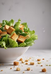Crunchy romaine lettuce, croutons and parmesan cheese falling onto a white plate  ,  tablecloth,  dropping