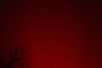 Starry Sky Above Red Aurora Glow