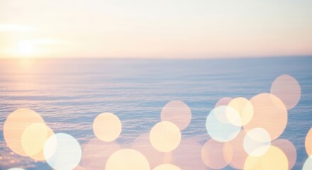 Gentle sea at sunrise blurred serenity with golden light orbs on soft light color palette