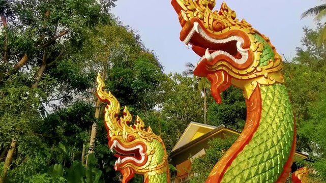 Suwankeereewong Temple green naga statue statues sculpture sculptures stairs Thailand.