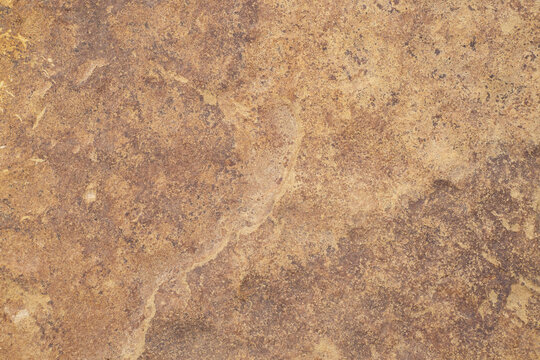 Stone texture close-up, surface. Brown stone background, wallpaper.