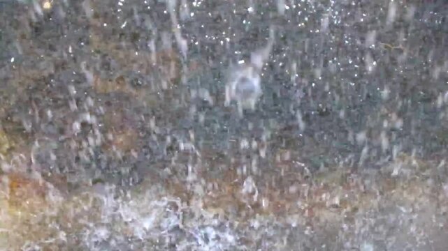 Heavy monsoon rain falls on the street ground texture Thailand.