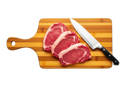 Red meat sliced on bamboo cutting board with knife in transparent background