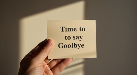 Farewell Message: A hand tenderly presents a card, the words Time to say Goodbye etched upon it, creating a moment of sentimental reflection.