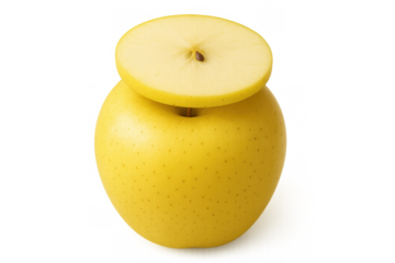Yellow apple cut open, revealing its crisp fleshy interior, core, and single seed, presenting a nutritious and fresh snack