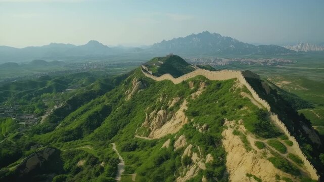 Stunning aerial view of the mountain landscape with ancient wall winding through lush greenery, Aerial shot panning from right to left, the mountain view of Henan, China