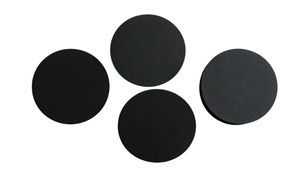 Four dark, textured circles on a black background - Powered by Adobe