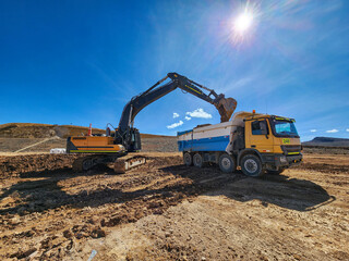 Construction machinery in the process of loading and transporting materials