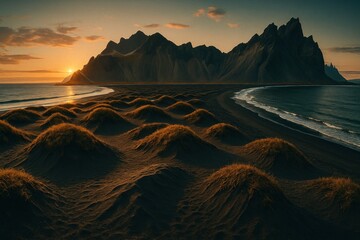 Golden sunset over a black sand beach with grassy dunes and rugged dark mountains