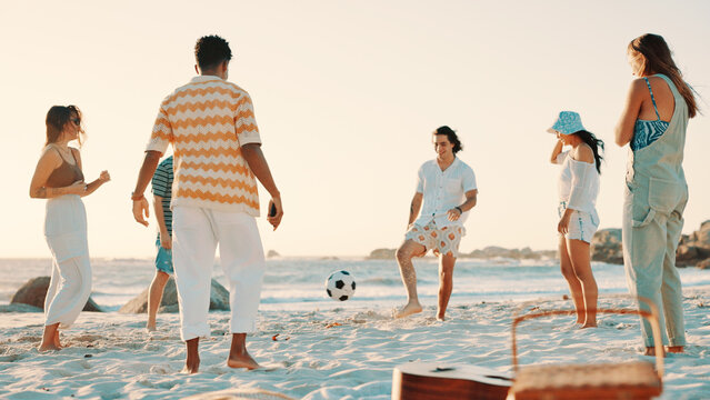 People, playing and beach with ball for social gathering, fun summer or outdoor bonding in nature. Group, friends or playful community with soccer on ocean coast for vacation, holiday or weekend