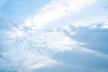 Soft blue summer clouds floating across the clear sky over Hokkaido, Japan, creating a refreshing and tranquil landscape filled with natural light and peaceful atmosphere.