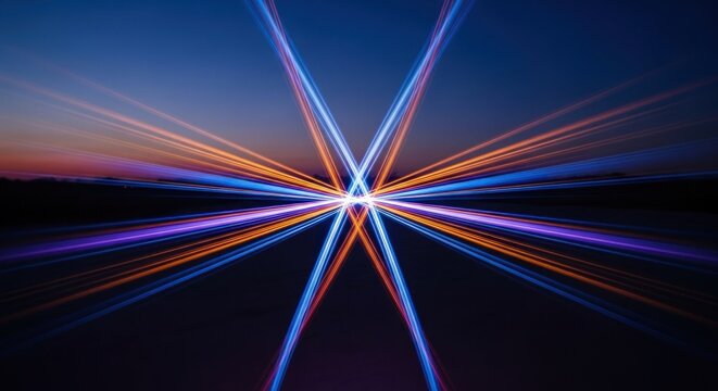 Symmetrical long exposure light trails forming a colorful starburst against a twilight sky