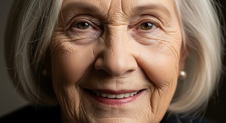 Serene portrait of a beautiful senior woman with a gentle smile, showcasing the beauty of aging with dignity