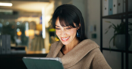 Tablet, night and happy business woman in office, reading report or fact check for article....