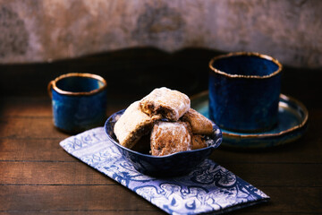 Traditional christmas cookies in a bowl on a wooden background. Soft focus.	