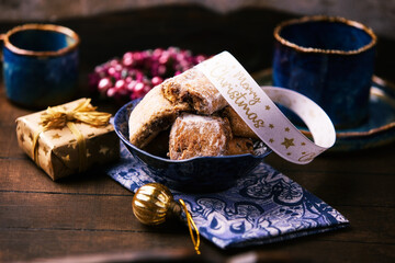 Traditional christmas cookies in a bowl on a wooden background. Soft focus.	