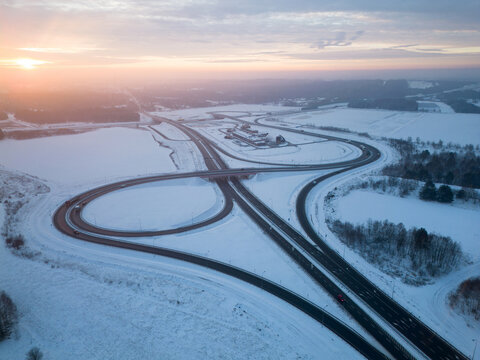 Sunrise Over Snowy Road in Winter Wilderness - Powered by Adobe