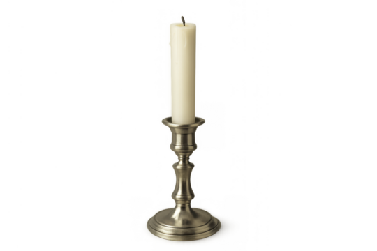 Unlit traditional taper candle with a black wick and white wax in a vintage silver candlestick