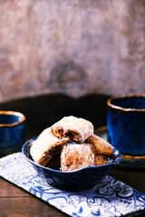 Traditional christmas cookies in a bowl on a rustic wooden background. Soft focus.	