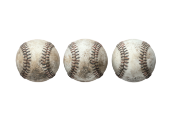 Three worn baseballs lined up on black
