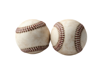 Two baseballs with red stitching against black background