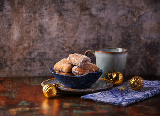 Traditional christmas cookies in a bowl on a rustic wooden background. Soft focus.	