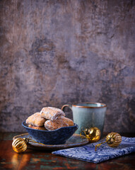 Traditional christmas cookies in a bowl on a rustic wooden background. Soft focus.	