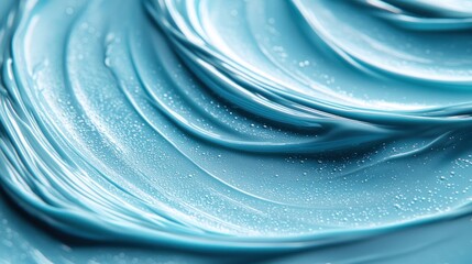 Swirled blue viscous liquid with glossy surface and tiny speckles; close-up macro view