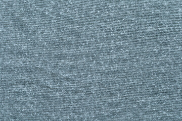A close-up shot of soft, flowing cotton fabric in a warm dark grey or charcoal tone. Copy space for your text and design. Textile concept and soft backdrop, Flat lay