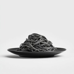A pile of black spaghetti on a black plate