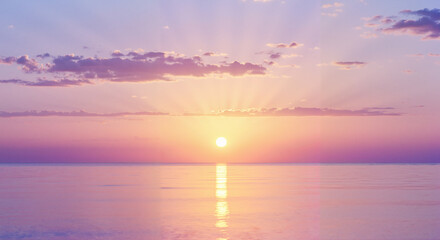Peaceful sunrise over calm ocean with soft purple hues in sky  