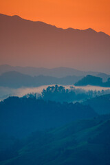 Sunrise view of hills and golden rice terraces at Mu Cang Chai town near Sapa city, North of Vietnam.