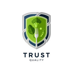 Shield logo with healthy food elements representing trust and quality.