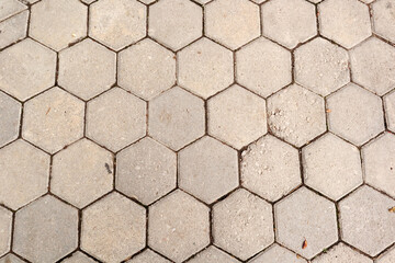 Honeycomb-shaped concrete sidewalk background.Top view