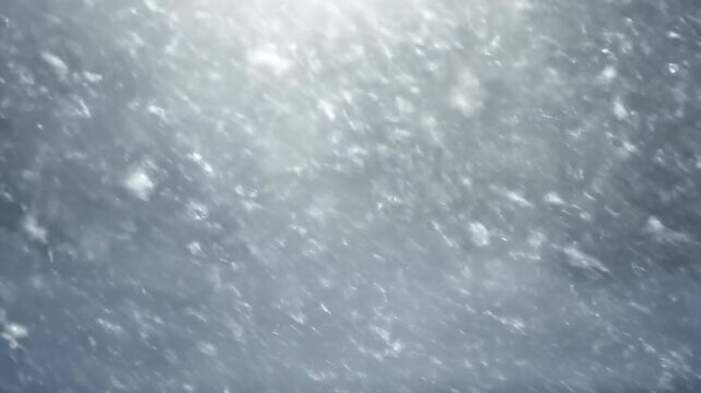 Abstract winter nature textures of blue ice and white frost patterns on the cold surface as water drops and flows into a frozen pool under a bright sky