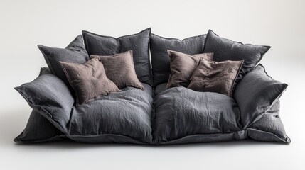 Plush, relaxed grey sofa with many square pillows against a plain white background