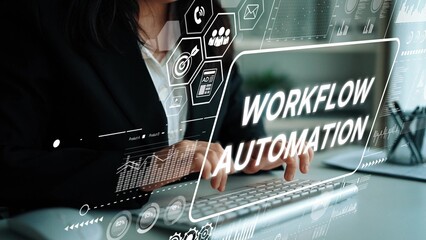 Professional businesswoman typing on a keyboard with workflow automation graphics and digital elements surrounding her in a modern office. Asymptotic smart data analytic.