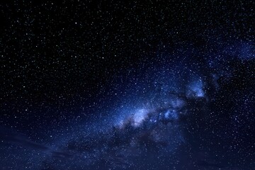 Fototapeta premium Dramatic Deep Blue Starry Night Sky with Milky Way Galaxy and Scattered White Stars in Celestial Space