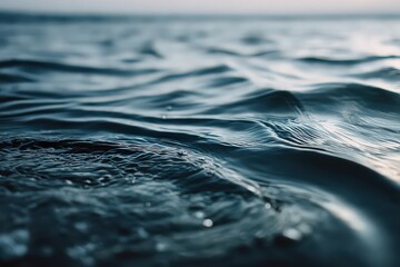 Close Up View of Dark Blue Ocean Water with Sun Glare Ripples and Wave Patterns Showing Texture and Surface Details for Abstract Marine Backgrounds
