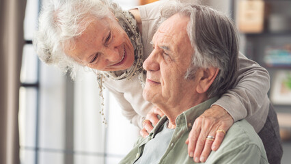 Elderly couple supporting each other