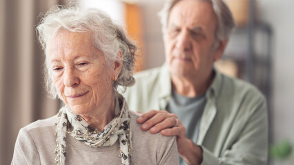 Depressed elderly woman receives support from husband