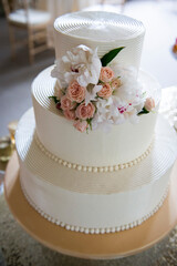 Elegant White Wedding Cake with Fresh Floral Topper