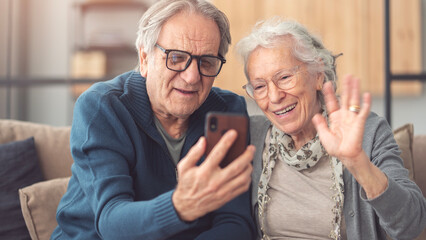 Elderly couple using smartphone for video call