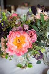 Bright Wedding Centerpiece Featuring Pink Peony and Foliage