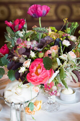 Bold Floral Centerpiece with Pink Poppies and Garden Roses