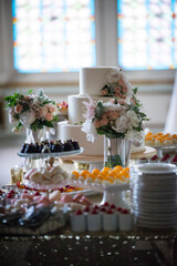 Elegant Wedding Dessert Table with Tiered Cake and Treats